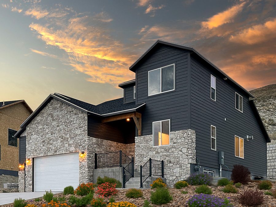 Exterior view of The Ross two-story home with a modern design featuring a welcoming porch and spacious garage. Exterior view of The Ross two-story home with a modern design featuring a welcoming porch and spacious garage.